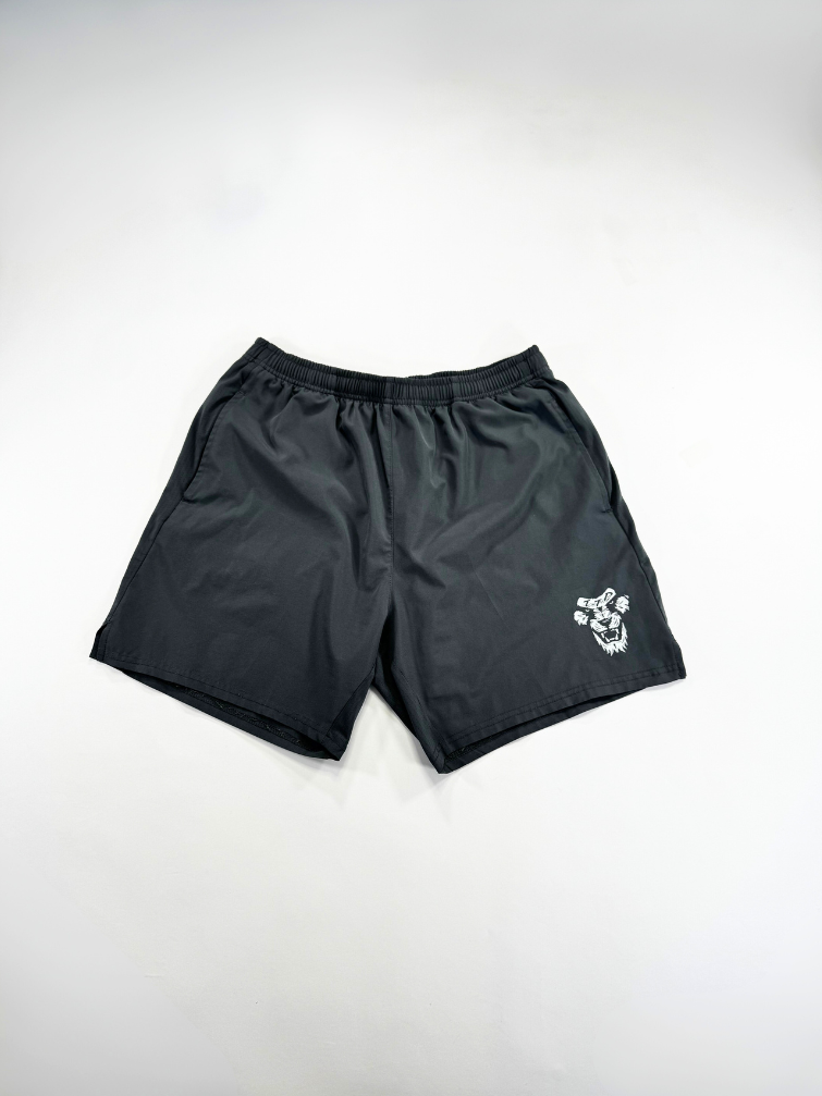 Gray shorts with a logo on a light gray background